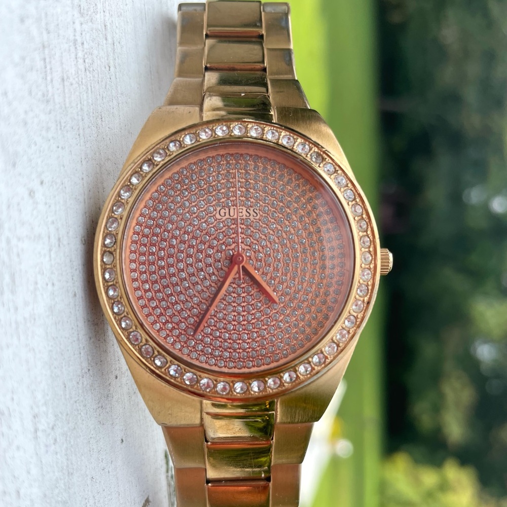 Rose gold Guess watch with crystal studded face.